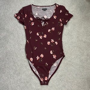 dark redish purple bodysuit with pink flowers